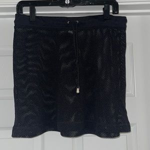 Mesh style swim cover up skirt. Good used condition.